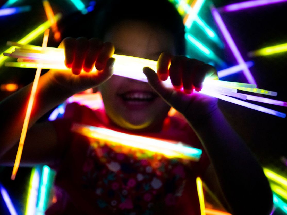 kid holding glowstick
