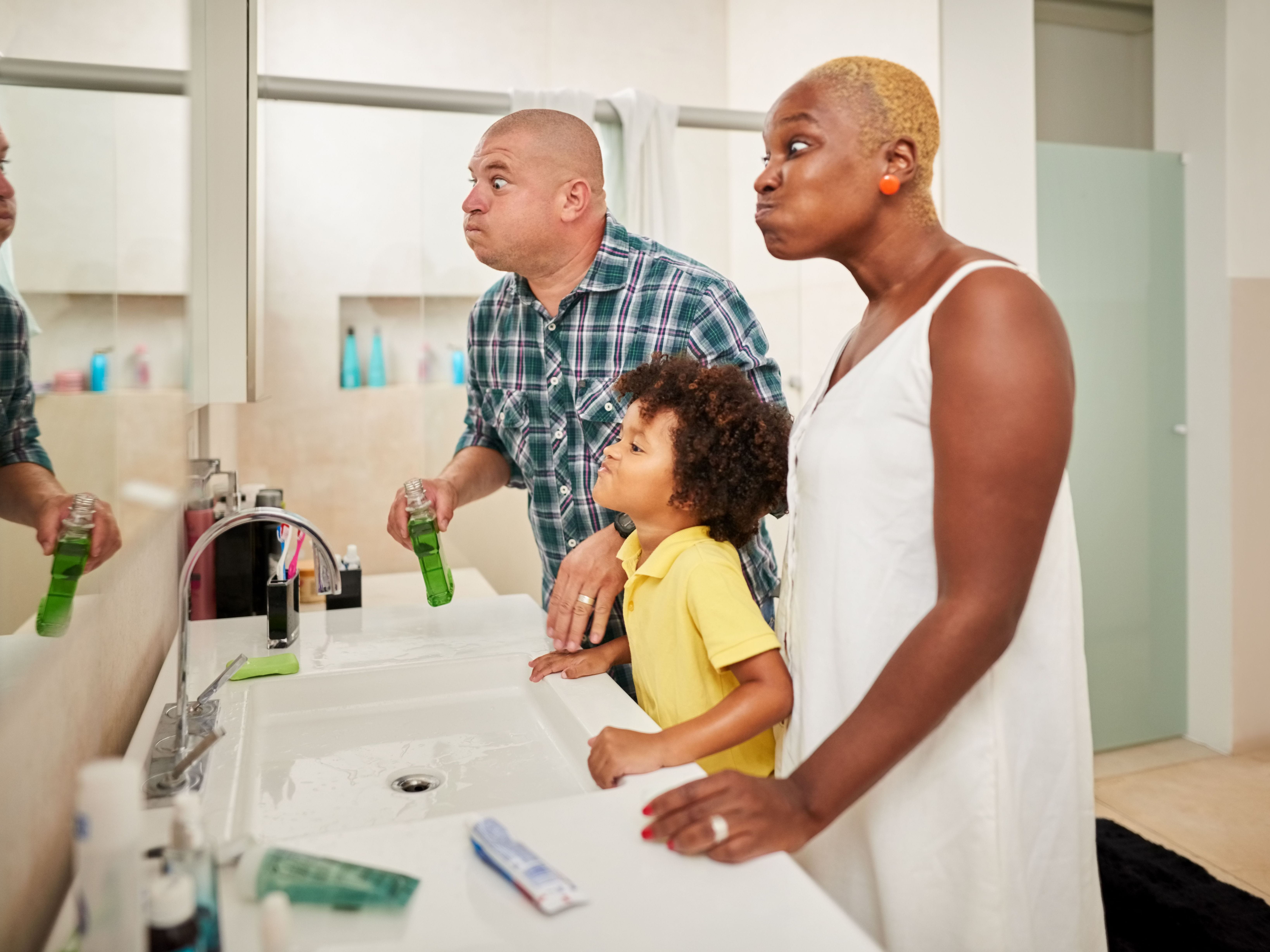 family rinsing mouths