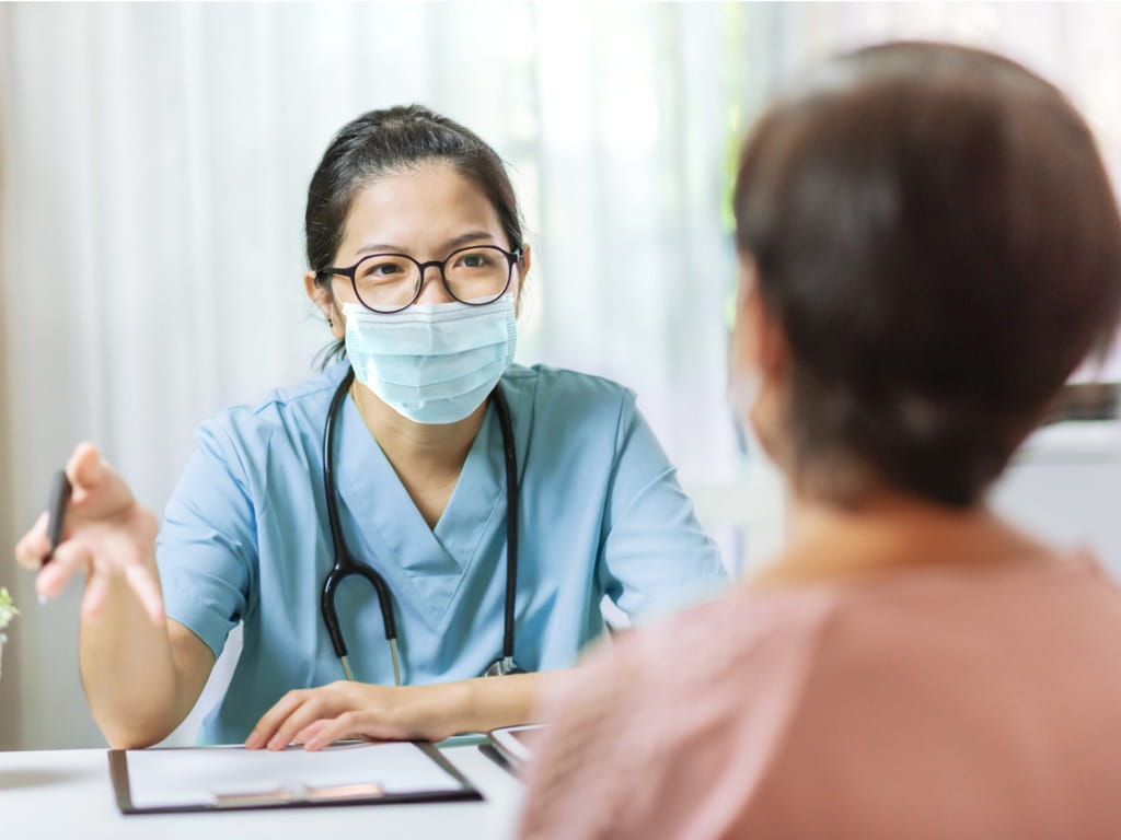 doctor speaking with patient