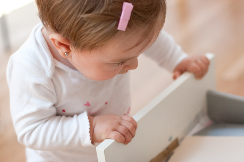 child opening drawer