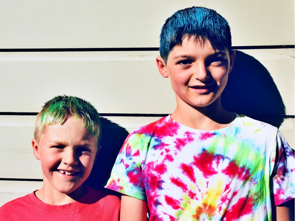 hair chalk two young boys with colored hair
