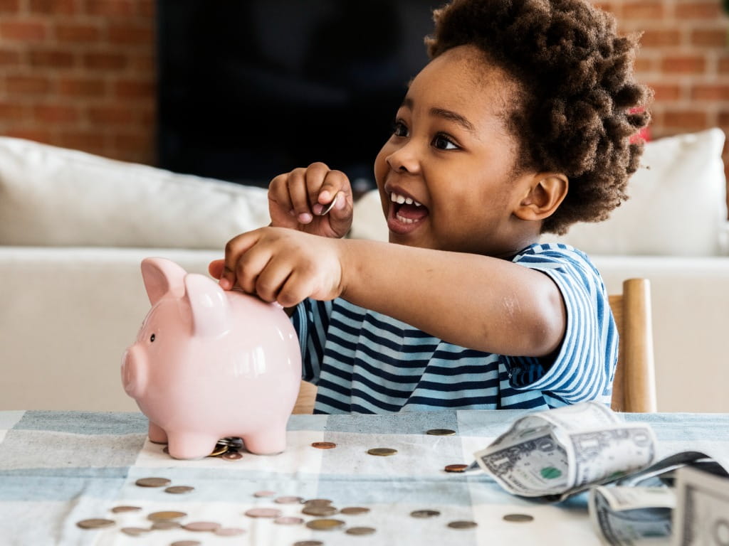 little boy collecting coins