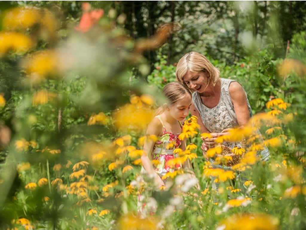 mother and daughter surrounded by black eyed susans