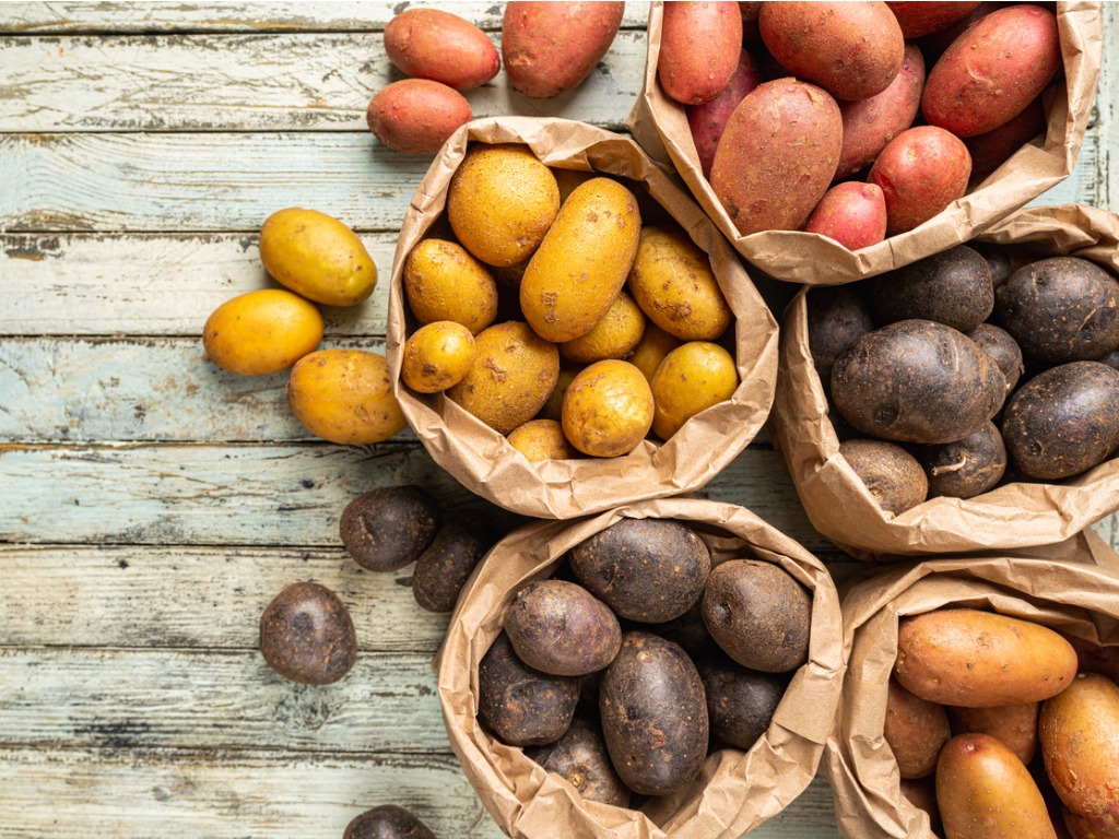 sacks of different types of potatoes