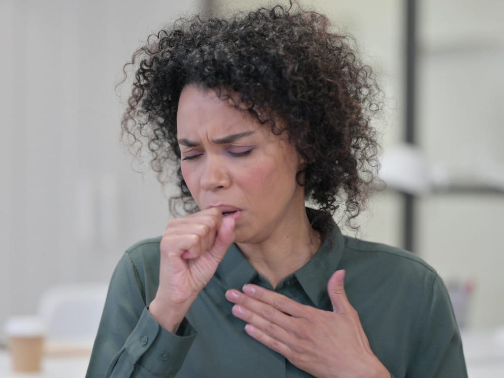 sick woman coughing