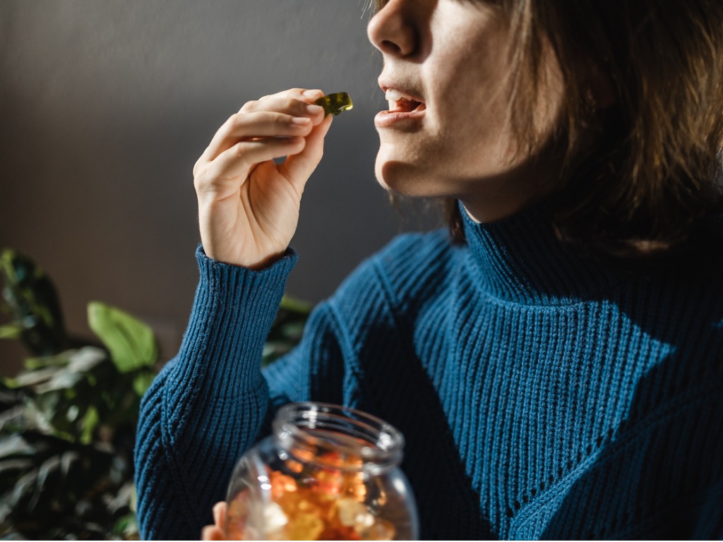 woman eating gummies