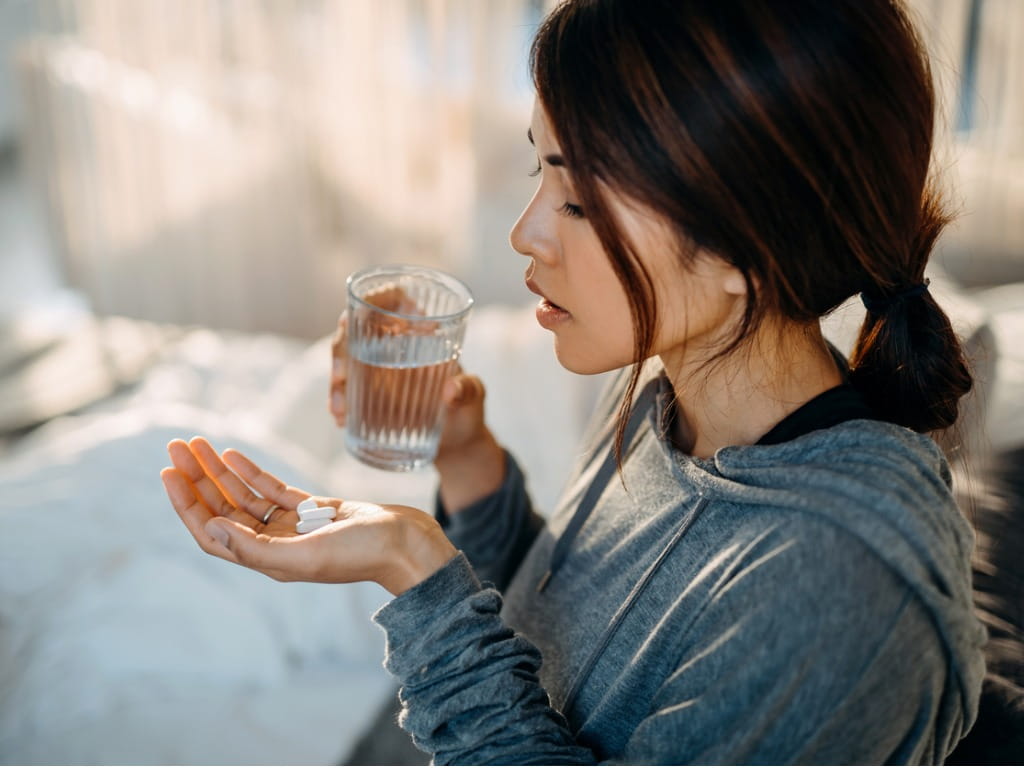 woman taking medication