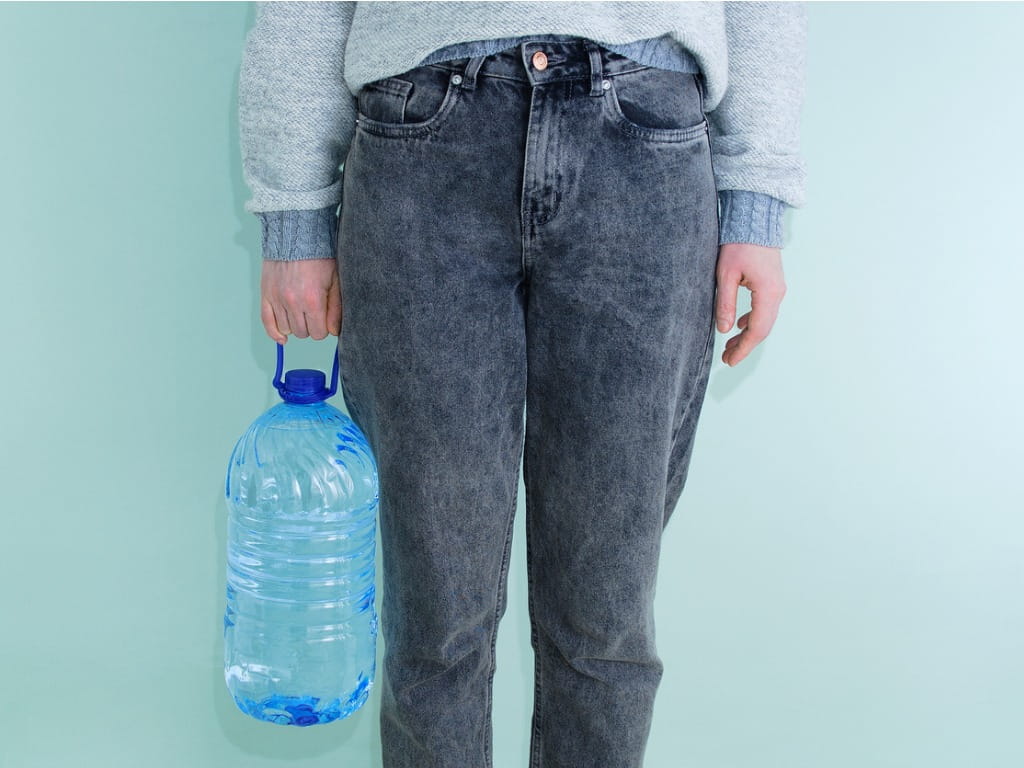 women holding a gallon bottle