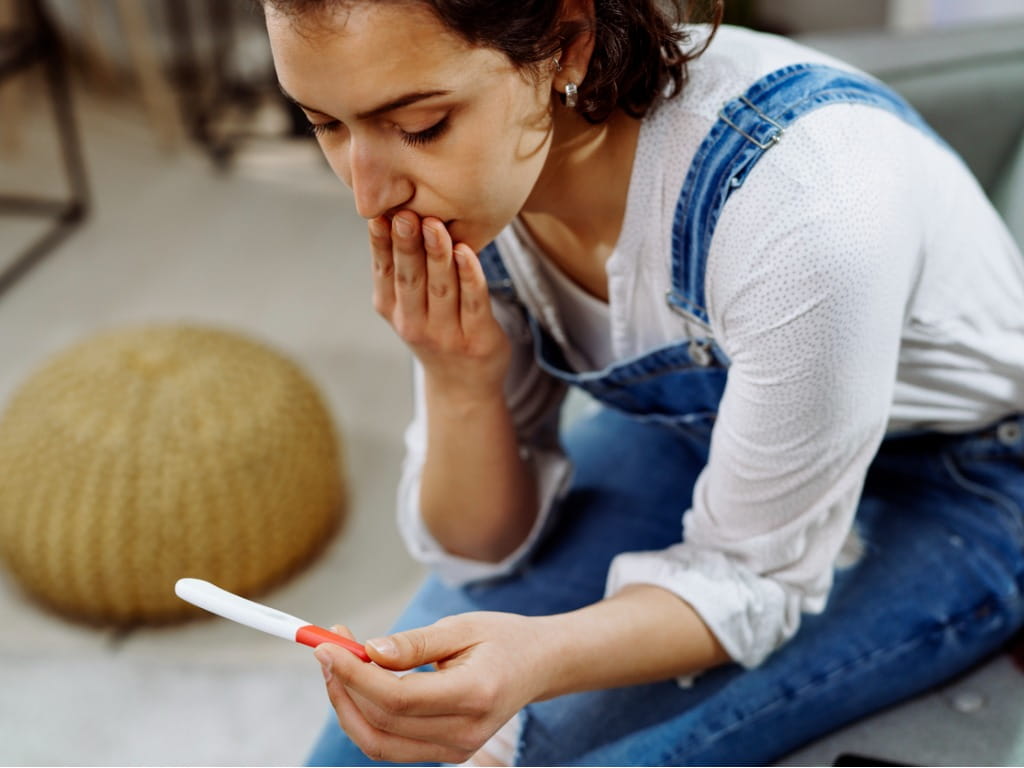 Woman worried with pregnancy test